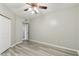 Bedroom with ceiling fan, wood floors, and closet with doors at 2625 Terra Ceia Bay Blvd # 406, Palmetto, FL 34221