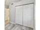 Bright bedroom features wood floors and a large closet with white paneled doors at 2625 Terra Ceia Bay Blvd # 406, Palmetto, FL 34221