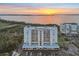 Exterior shot of the condo building highlighting the surrounding water and sunset at 2625 Terra Ceia Bay Blvd # 406, Palmetto, FL 34221