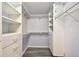 Walk-in closet with laminate floors, shelving, and multiple drawers for maximum storage at 2625 Terra Ceia Bay Blvd # 406, Palmetto, FL 34221
