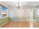 Open dining area with natural light, wood floors, and stylish chandelier at 2625 Terra Ceia Bay Blvd # 406, Palmetto, FL 34221