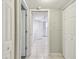 Hallway with white tile floors and multiple entrances to other rooms in the unit at 2625 Terra Ceia Bay Blvd # 406, Palmetto, FL 34221