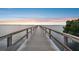 Scenic view of long wooden pier stretching over calm water towards the horizon at 2625 Terra Ceia Bay Blvd # 406, Palmetto, FL 34221