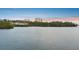 Beautiful water view showcasing the building's location near tranquil waters and lush green trees at sunset at 2625 Terra Ceia Bay Blvd # 406, Palmetto, FL 34221
