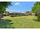 Expansive backyard with a screened pool, lush landscaping, and a well-maintained lawn at 2914 Timber Knoll Dr, Valrico, FL 33596