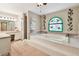 Bright bathroom features a large soaking tub and separate glass shower at 2914 Timber Knoll Dr, Valrico, FL 33596