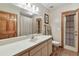 Bright bathroom with large mirror, white vanity, and updated fixtures at 2914 Timber Knoll Dr, Valrico, FL 33596