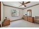 Well-lit bedroom offers neutral carpet, dresser, ceiling fan, and closet space at 2914 Timber Knoll Dr, Valrico, FL 33596
