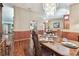 Formal dining room boasting wood floors, a modern chandelier, and space for entertaining at 2914 Timber Knoll Dr, Valrico, FL 33596