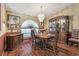 Elegant dining room featuring a chandelier, wood flooring, and classic furnishings at 2914 Timber Knoll Dr, Valrico, FL 33596