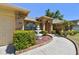 Inviting entryway featuring a decorative fountain and lush landscaping at 2914 Timber Knoll Dr, Valrico, FL 33596
