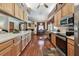 Bright kitchen with wooden cabinets, stainless steel appliances, and seamless connection to the dining area at 2914 Timber Knoll Dr, Valrico, FL 33596