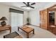 Bright living room features neutral carpet, ceiling fan, and natural light from the sliding doors at 2914 Timber Knoll Dr, Valrico, FL 33596