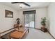 Carpeted room with view of covered patio and pool through sliding glass doors at 2914 Timber Knoll Dr, Valrico, FL 33596