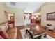 Open-concept living area boasting wood floors, an open floorplan, and lots of natural light at 2914 Timber Knoll Dr, Valrico, FL 33596