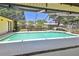 Screened-in pool area features a fountain, spacious deck, and lush landscaping at 2914 Timber Knoll Dr, Valrico, FL 33596