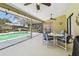 Enclosed patio with view of the screened pool and fountain, perfect for relaxing at 2914 Timber Knoll Dr, Valrico, FL 33596