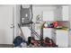 Functional basement area with essential utilities, storage solutions, and tools neatly organized for practical household management at 2964 Catherine Dr, Clearwater, FL 33759