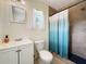 Bathroom featuring a shower, toilet, vanity and window at 2964 Catherine Dr, Clearwater, FL 33759