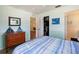 Inviting bedroom featuring a dresser, and open closet, providing storage and access to other areas of the home at 2964 Catherine Dr, Clearwater, FL 33759