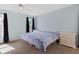 Inviting bedroom with neutral carpeting and blue walls at 2964 Catherine Dr, Clearwater, FL 33759