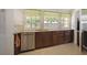 Functional kitchen with stainless steel appliances, tiled backsplash, and ample cabinet space at 2964 Catherine Dr, Clearwater, FL 33759