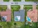 Aerial view of neighborhood featuring attractive homes, landscaped yards, and inviting swimming pools at 3168 Masters Dr, Clearwater, FL 33761
