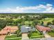 Beautiful home in golf community with great views, screened pool, and well maintained landscaping at 3168 Masters Dr, Clearwater, FL 33761