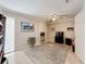 Bedroom showcasing a ceiling fan, neutral walls and flooring, closet and door to another room at 3168 Masters Dr, Clearwater, FL 33761