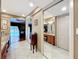 Hallway with access to the main bedroom, bathroom, and mirrored closet doors at 3168 Masters Dr, Clearwater, FL 33761