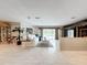 Bright and airy living room with tile floors and access to the lanai and pool at 3168 Masters Dr, Clearwater, FL 33761