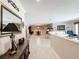 Open living room with tile floors and neutral decor provides a bright and airy atmosphere at 3168 Masters Dr, Clearwater, FL 33761