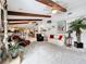 Bright living room with high ceilings, wood beams, an open floor plan and carpeted floor at 3168 Masters Dr, Clearwater, FL 33761