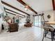Cozy living room with vaulted ceilings and fireplace with a view to the pool area at 3168 Masters Dr, Clearwater, FL 33761
