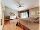 Cozy main bedroom with wood floors and sliding glass doors to the pool at 3168 Masters Dr, Clearwater, FL 33761