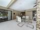 Covered patio seating area with convenient access to the pool and the main house, perfect for entertaining at 3168 Masters Dr, Clearwater, FL 33761