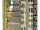 Aerial view showcasing the backyard, neighborhood street, and well-manicured lawns at 31779 Asbury Ave, Wesley Chapel, FL 33545