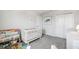 Neutral toned Bedroom with a crib, bookcase, and natural lighting at 31779 Asbury Ave, Wesley Chapel, FL 33545