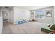 Upstairs bonus room with a carpeted floor and a large window offering plenty of natural light at 31779 Asbury Ave, Wesley Chapel, FL 33545