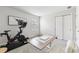 Bright room set up as a home gym and workspace with neutral decor at 31779 Asbury Ave, Wesley Chapel, FL 33545