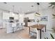 Bright, modern kitchen with white cabinets, stainless steel appliances, and an island with bar seating at 31779 Asbury Ave, Wesley Chapel, FL 33545