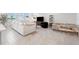 Bright living room with large windows, comfortable seating, and tile flooring at 31779 Asbury Ave, Wesley Chapel, FL 33545