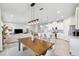 Open-concept living space with a modern kitchen, dining area, and comfortable living room at 31779 Asbury Ave, Wesley Chapel, FL 33545