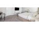 View of the main bedroom with a tv, desk, carpet, and a neutral color palette at 31779 Asbury Ave, Wesley Chapel, FL 33545