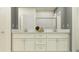 Elegant bathroom with double vanity, white cabinetry, and subway-tiled shower at 32122 Griffin Sands Ln, San Antonio, FL 33576