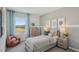 Cozy bedroom featuring a wood frame bed with a large window showing views of the landscape at 32730 Winterwood Boulevard Blvd, Wesley Chapel, FL 33543