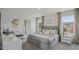 Spacious bedroom with neutral tones, large windows, and coordinated decor for a serene and inviting atmosphere at 32730 Winterwood Boulevard Blvd, Wesley Chapel, FL 33543