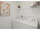 Functional laundry room with modern appliances and ample storage space at 32730 Winterwood Boulevard Blvd, Wesley Chapel, FL 33543