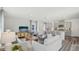 Spacious living area connecting the living room, kitchen, and dining area with stylish decor at 32730 Winterwood Boulevard Blvd, Wesley Chapel, FL 33543