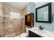 This bathroom has a stand up shower with unique sliding cabinet for storage above the toilet at 3407 Cason Rd, Plant City, FL 33566